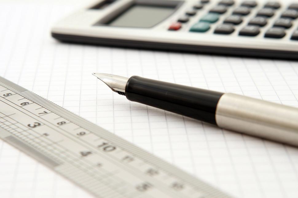 Free Image of Pen, Ruler, and Calculator on Table 