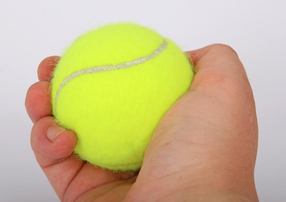 Free Image of Person Holding Tennis Ball 
