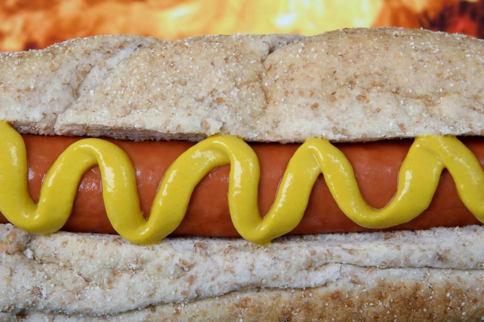 Free Image of Hot Dog With Mustard and Ketchup on a Bun 