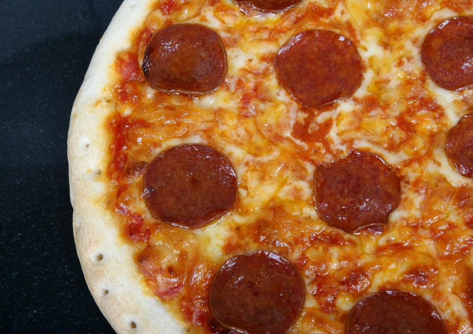 Free Image of Pepperoni Pizza on Table 