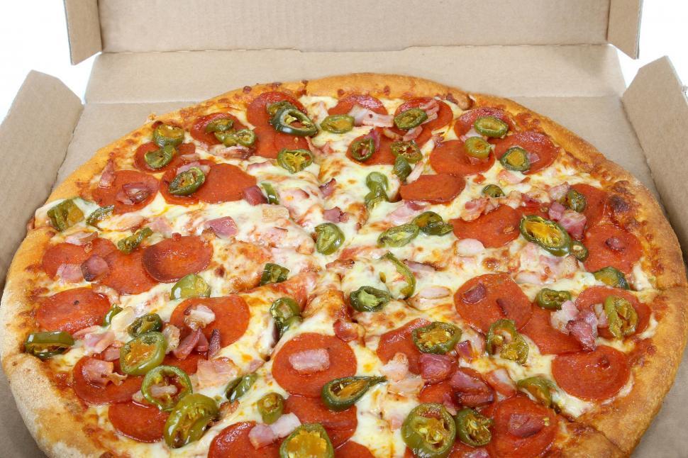 Free Image of Delicious Pizza With Pepperoni, Jalapenos, and Various Toppings 