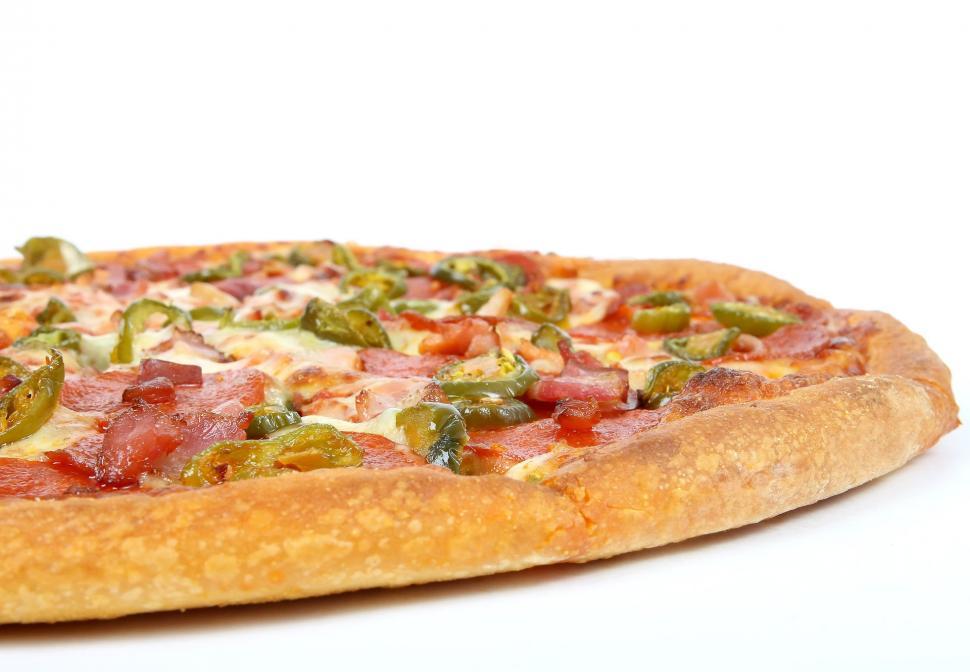 Free Image of Close Up of a Pizza on a White Surface 
