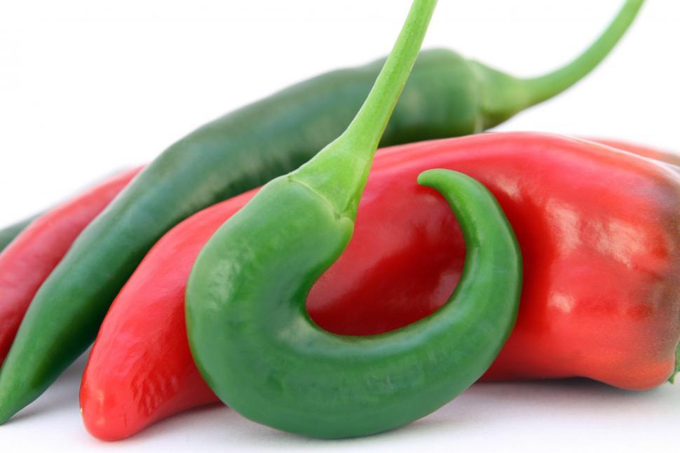 Free Image of Green and Red Peppers on White Surface 