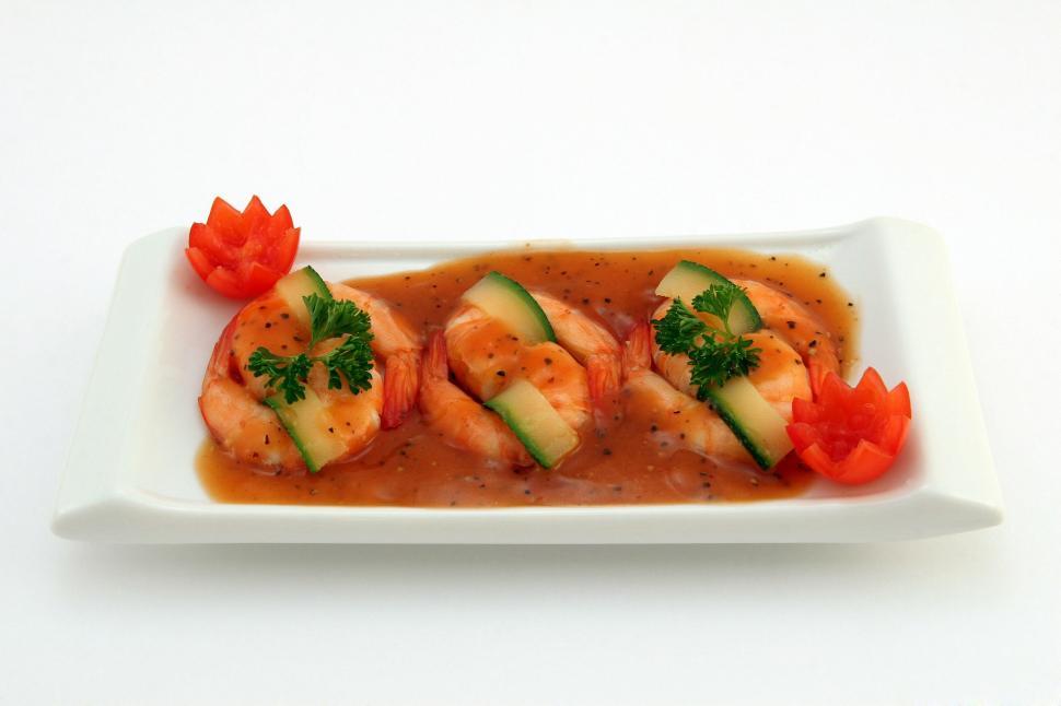 Free Image of White Plate With Shrimp Covered in Sauce 