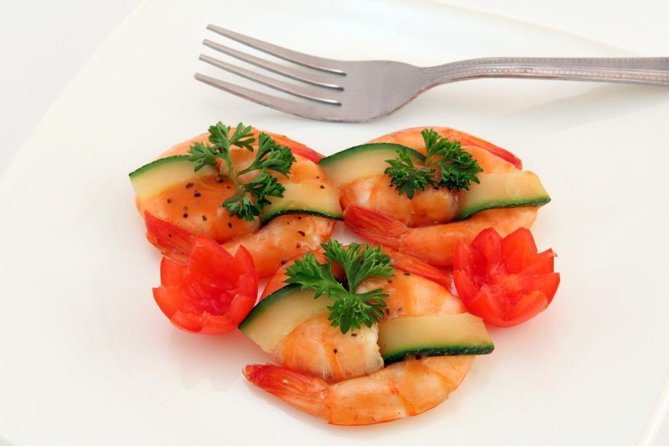 Free Image of White Plate Topped With Shrimp and Cucumbers 
