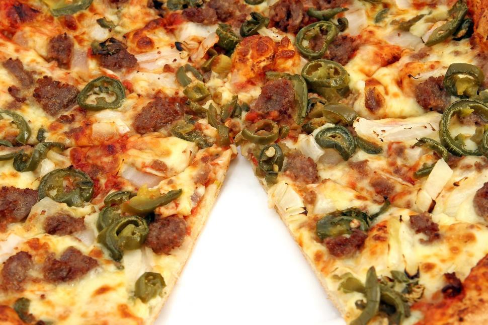 Free Image of Close Up of Pizza on White Surface 