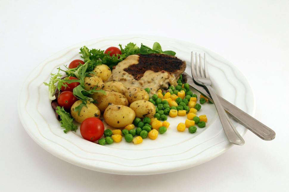 Free Image of White Plate Topped With Meat and Vegetables 