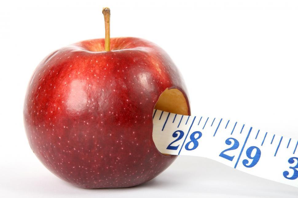 Free Image of Measuring Tape Wrapped Around an Apple 