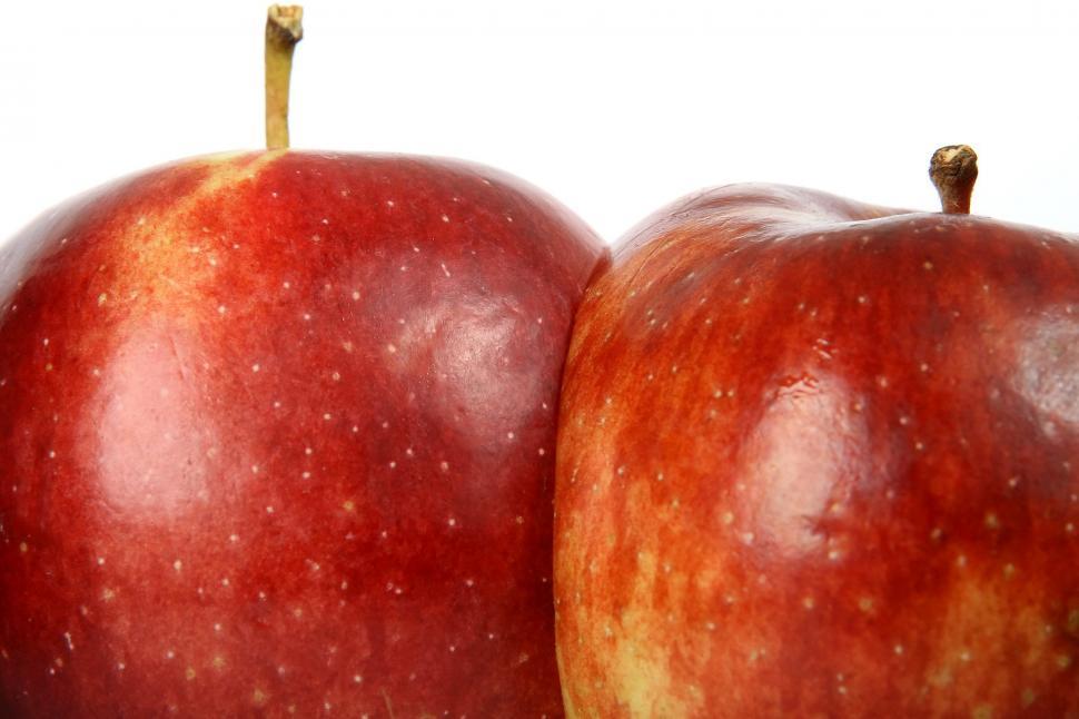 Free Image of Two Red Apples Sitting Next to Each Other 