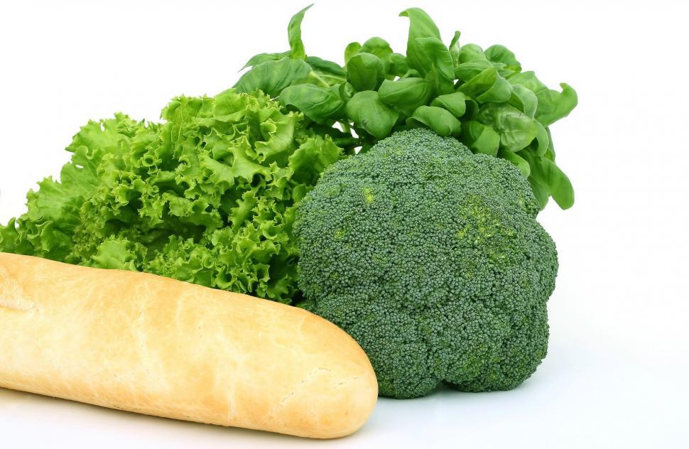 Free Image of Fresh Broccoli, Lettuce, and Bread on White Background 