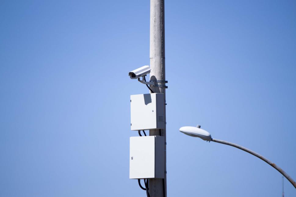 Free Image of Security camera on blue background 