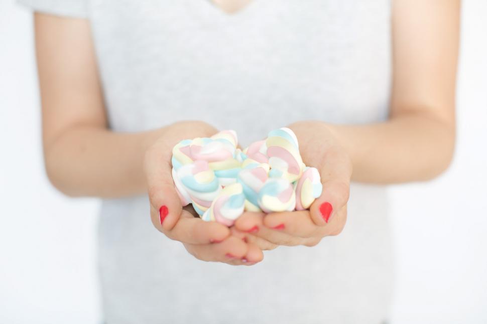 Download Free Stock Photo of Hands Holding Marshmallow Candy 