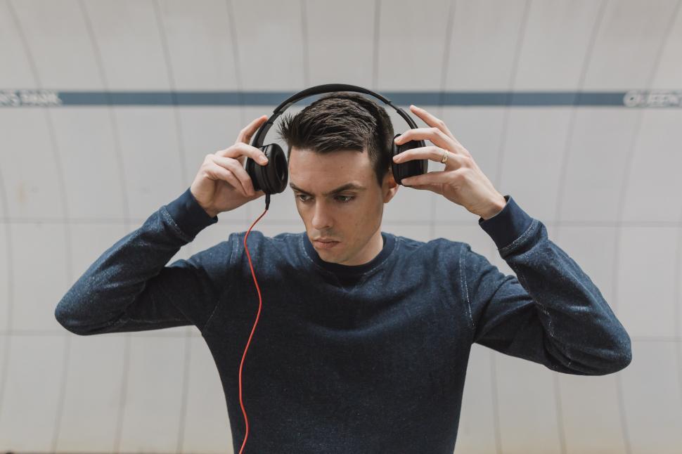 Download Free Stock Photo of Putting On Headphones 