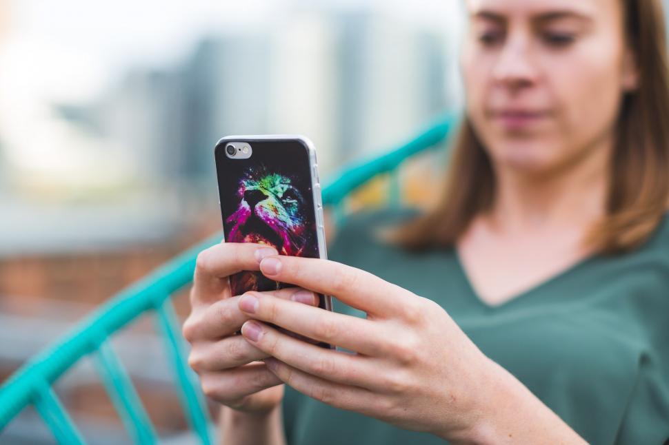 Free Image of Woman Using Smart Phone With Case 