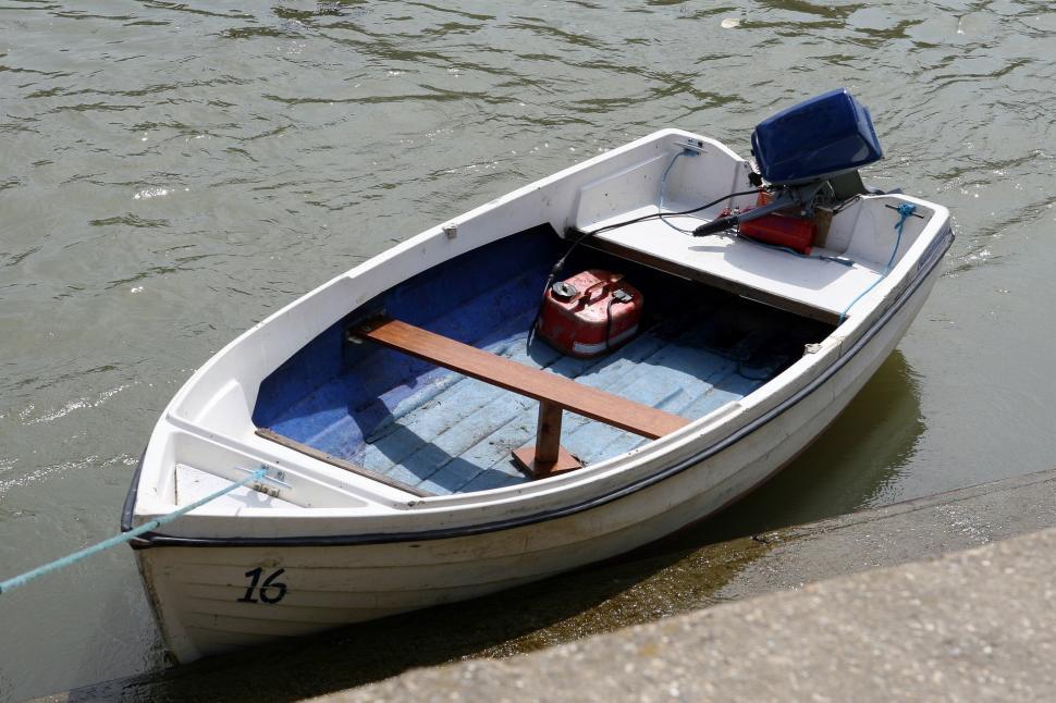 Free Image of Small Boat Tied to Dock 