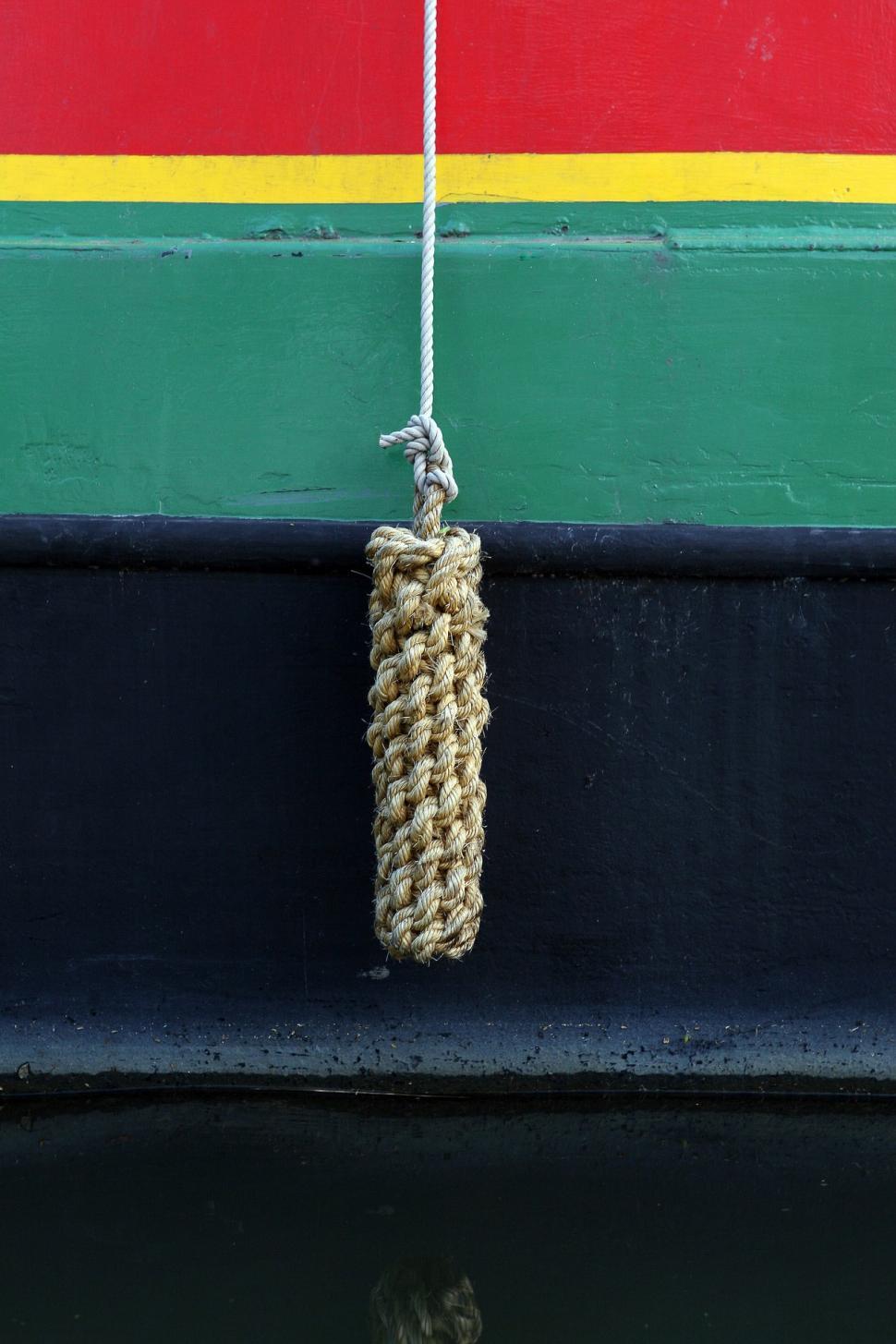 Free Image of Rope Hanging From the Side of a Boat 