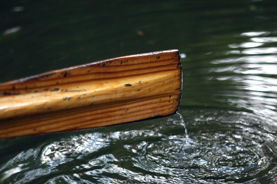 Free Image of Wooden Boat Floating on Body of Water 
