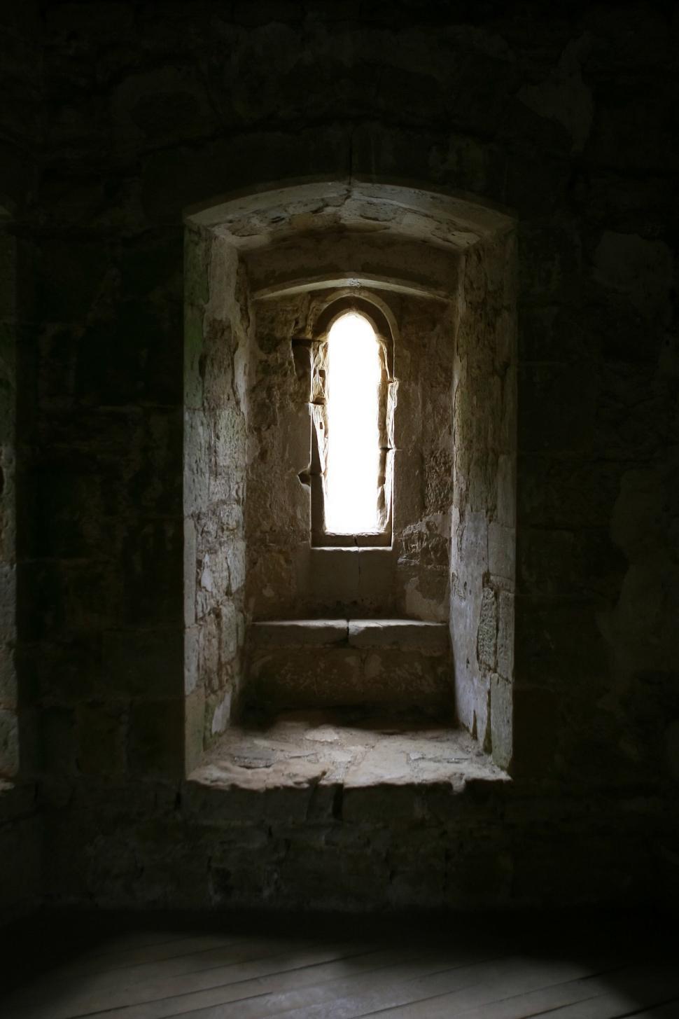 Free Image of Dark Room With Window and Wooden Floor 
