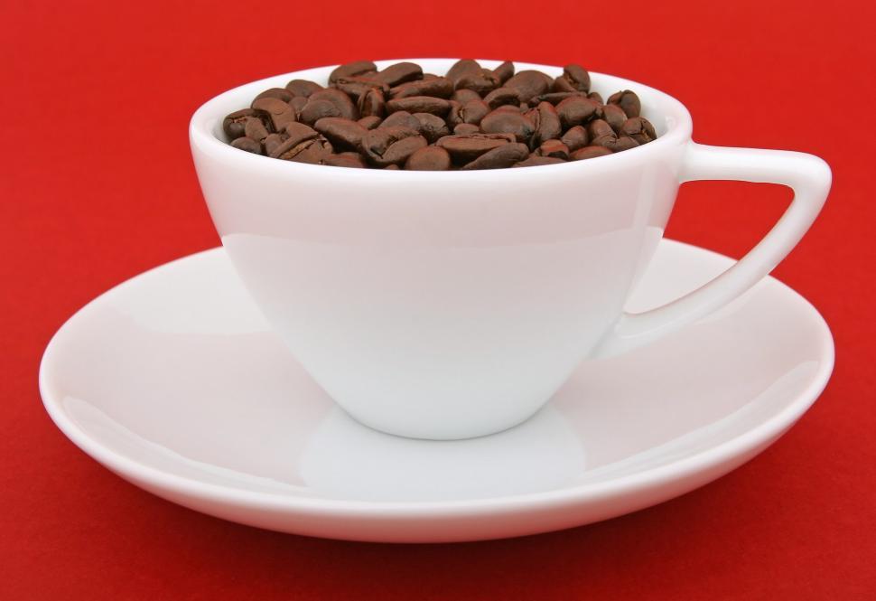 Free Image of White Cup Filled With Coffee Beans on Saucer 
