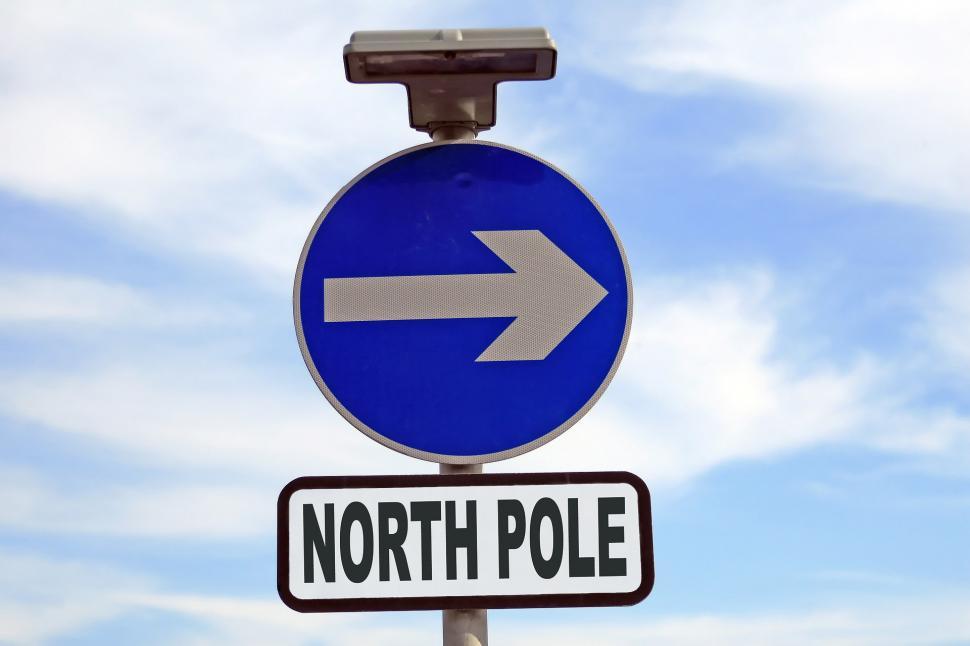 Free Image of Street Sign With Arrow Pointing to the North Pole 