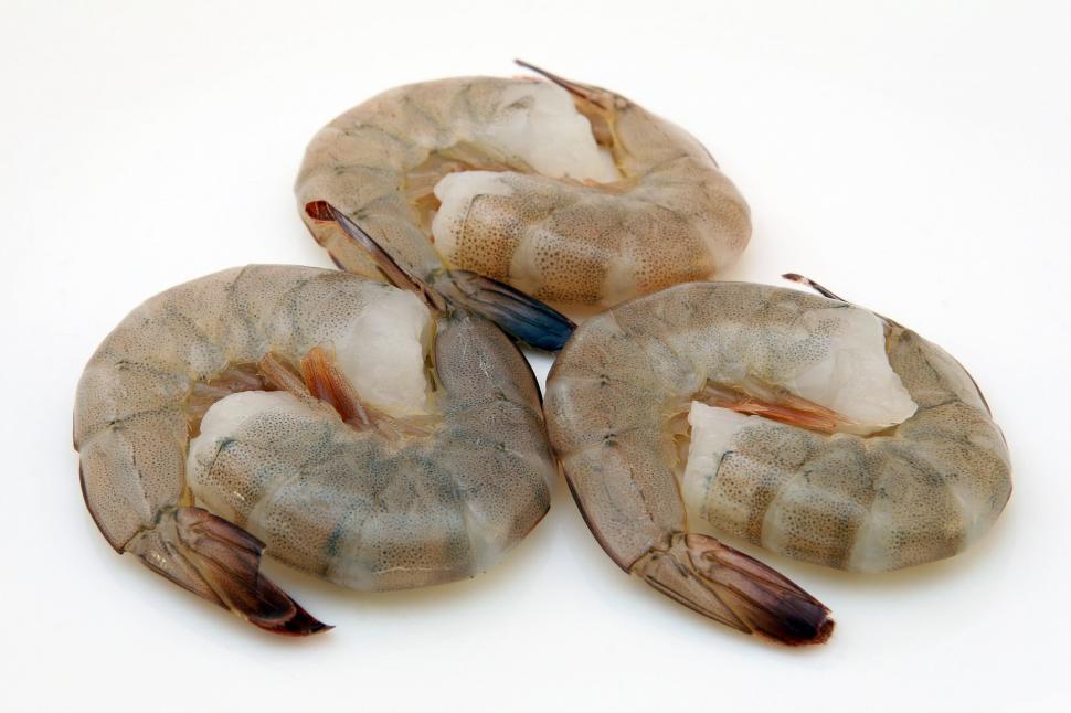 Free Image of Three Raw Shrimps Stacked Together 