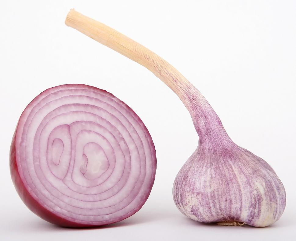 Free Image of Close Up of an Onion and a Wooden Spoon 