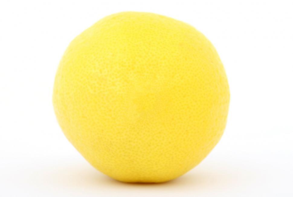 Free Image of Yellow Bath Ball on White Background 