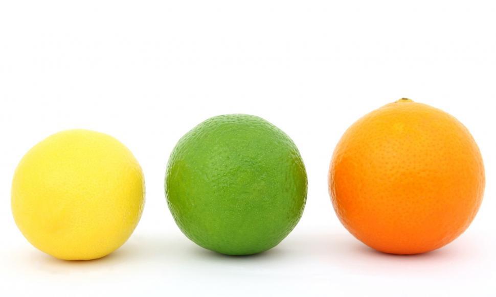 Free Image of Three Oranges, One Green and One Yellow 