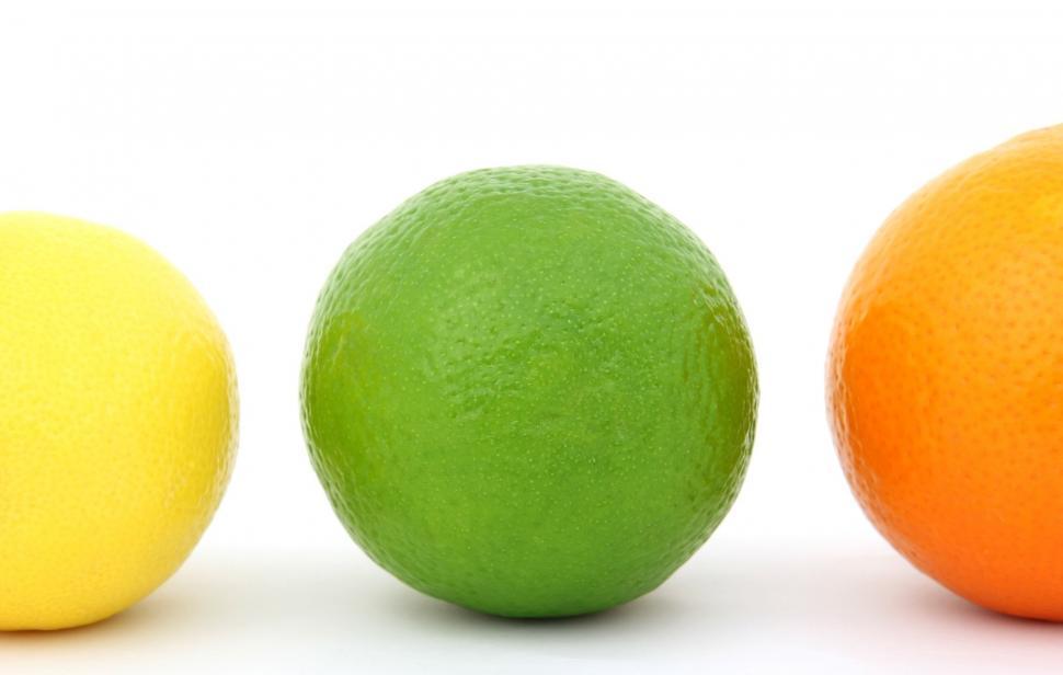 Free Image of Three Oranges, One Green and One Yellow 