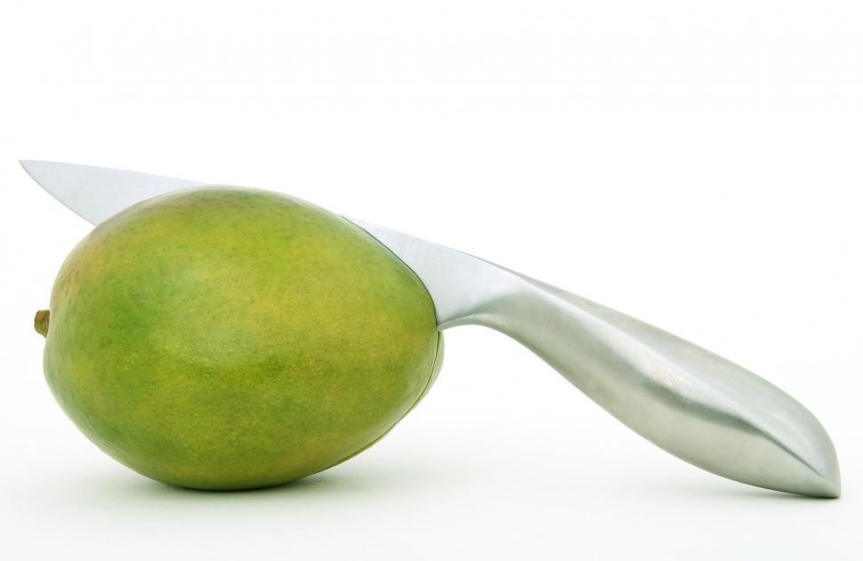 Free Image of Green Apple Impaled by Knife 
