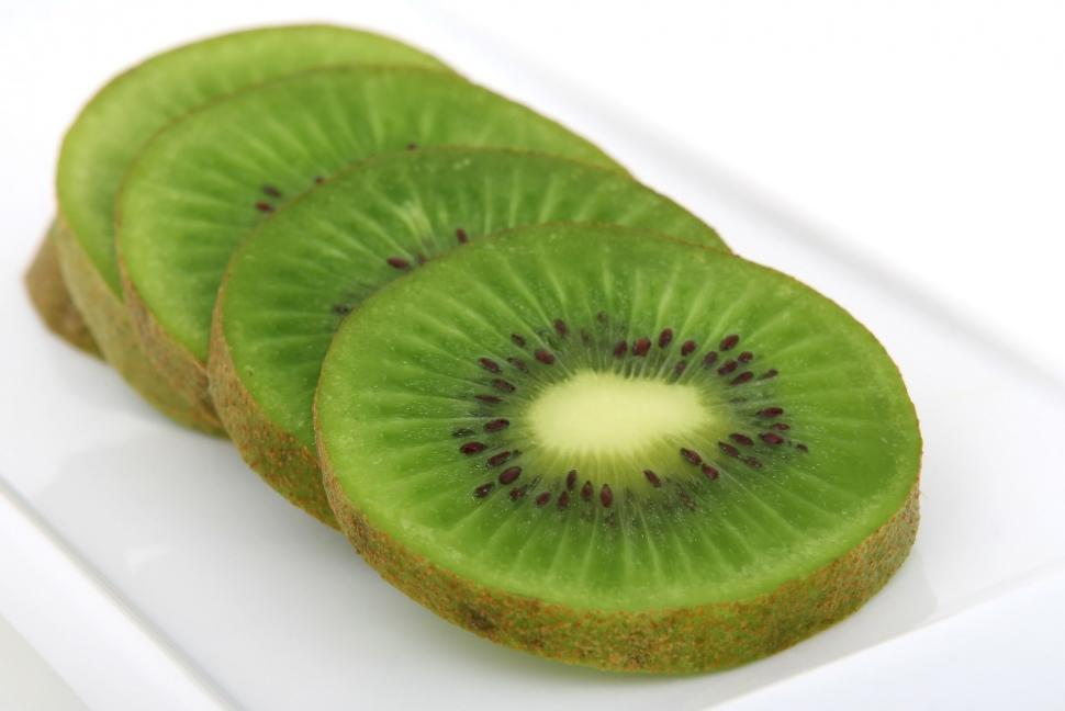 Free Image of Slices of Kiwi on a White Plate 