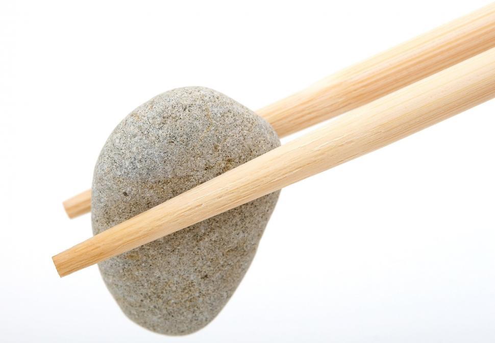 Free Image of Chopsticks Stuck in Rock 