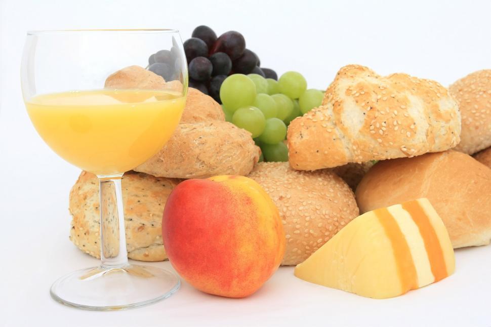 Free Image of Glass of Orange Juice With Bread and Fruit 