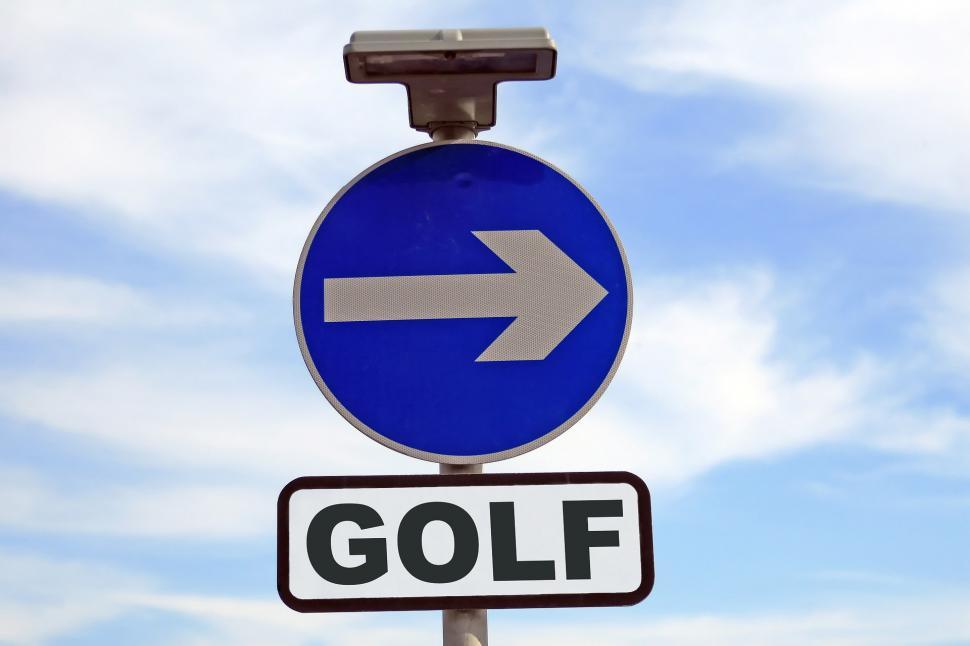 Free Image of Blue Golf Sign With Arrow Pointing Right 
