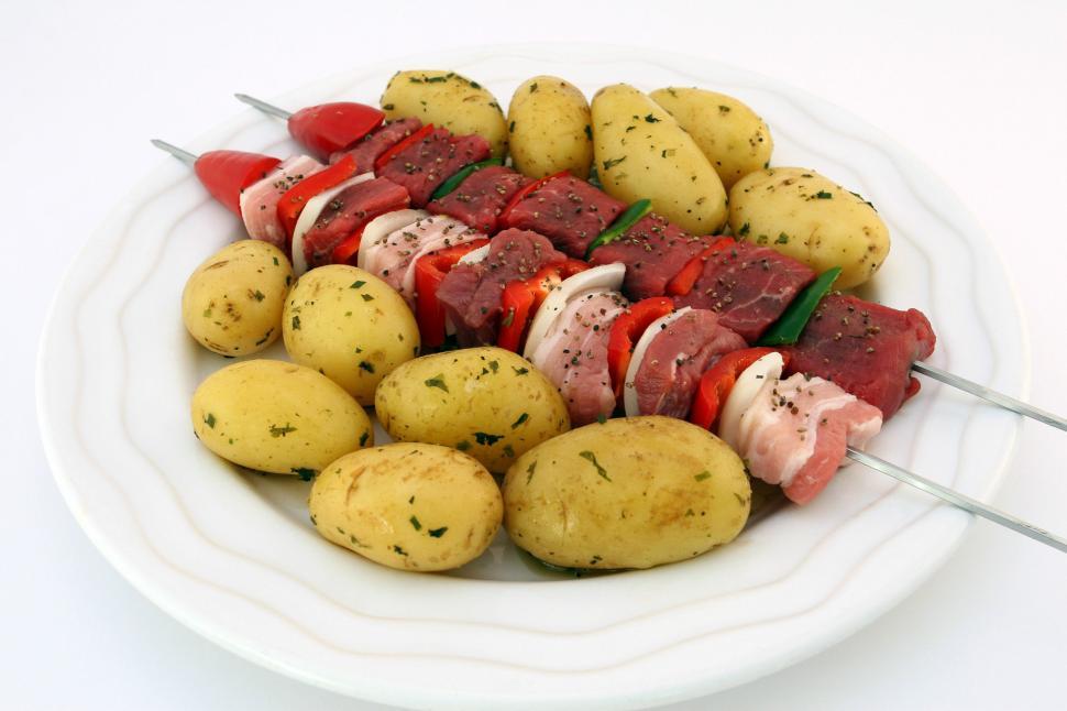 Free Image of White Plate With Meat and Potato Skewers 