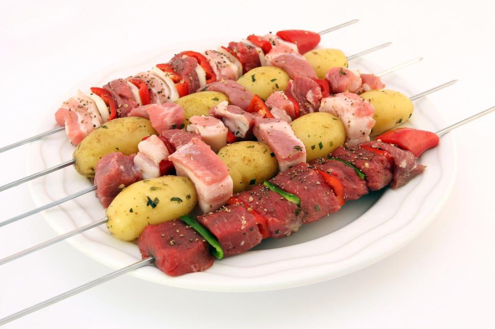 Free Image of White Plate With Skewers of Meat and Potatoes 