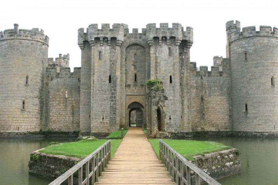 Free Image of Wooden Walkway Leading to Castle-Like Structure 