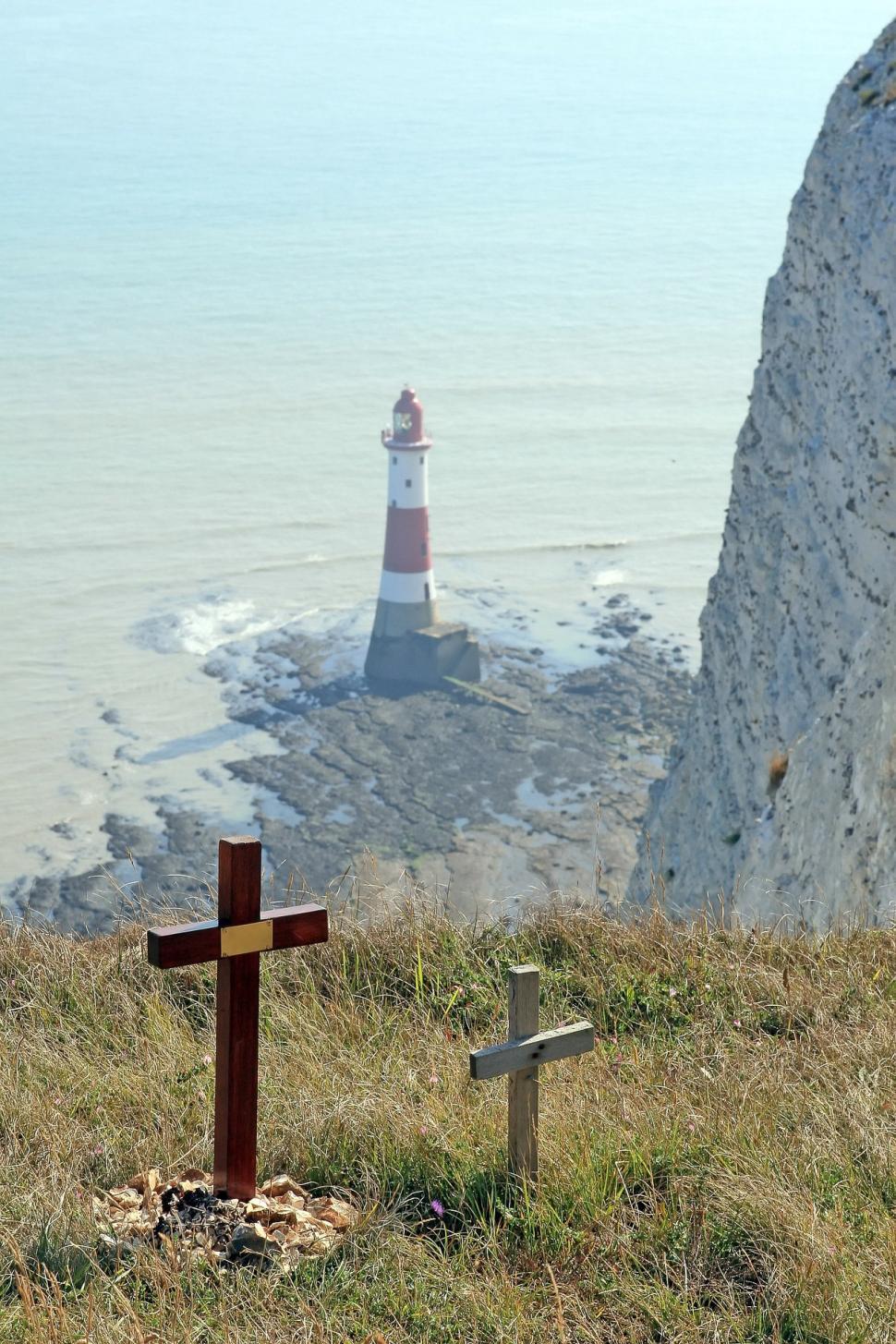 Free Image of Cross on Hill Overlooking Lighthouse 