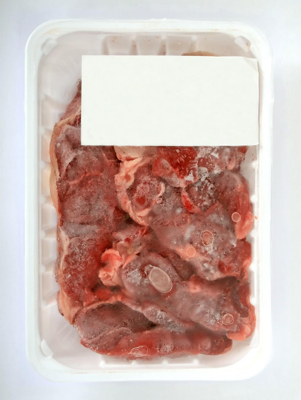 Free Image of Plastic Container Filled With Meat and White Label 