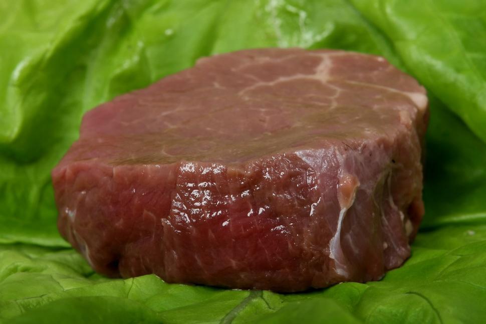 Free Image of Piece of Meat on Green Cloth 