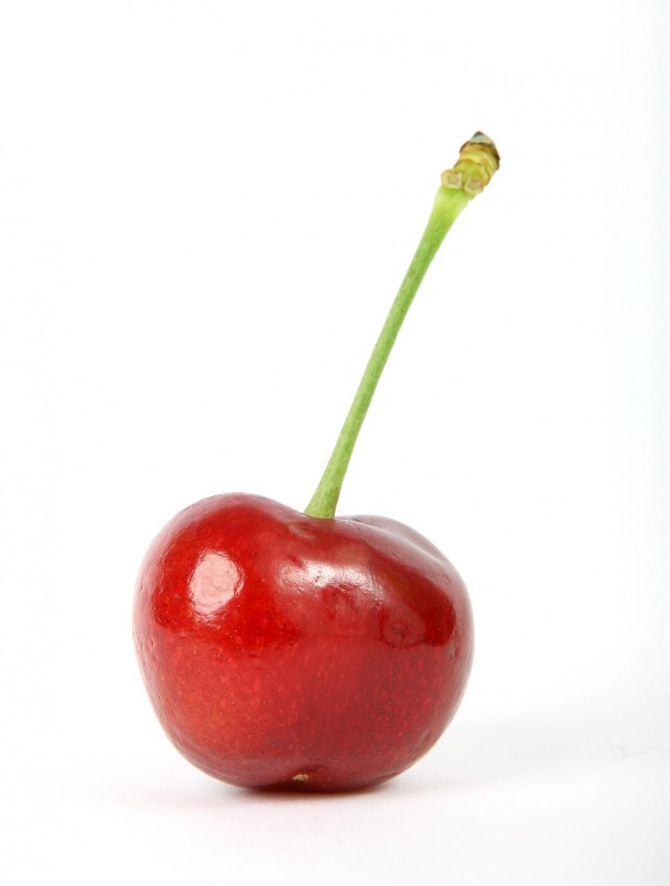 Free Image of Single Cherry on White Surface 