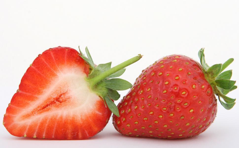 Free Image of Close Up of Two Strawberries on White Background 