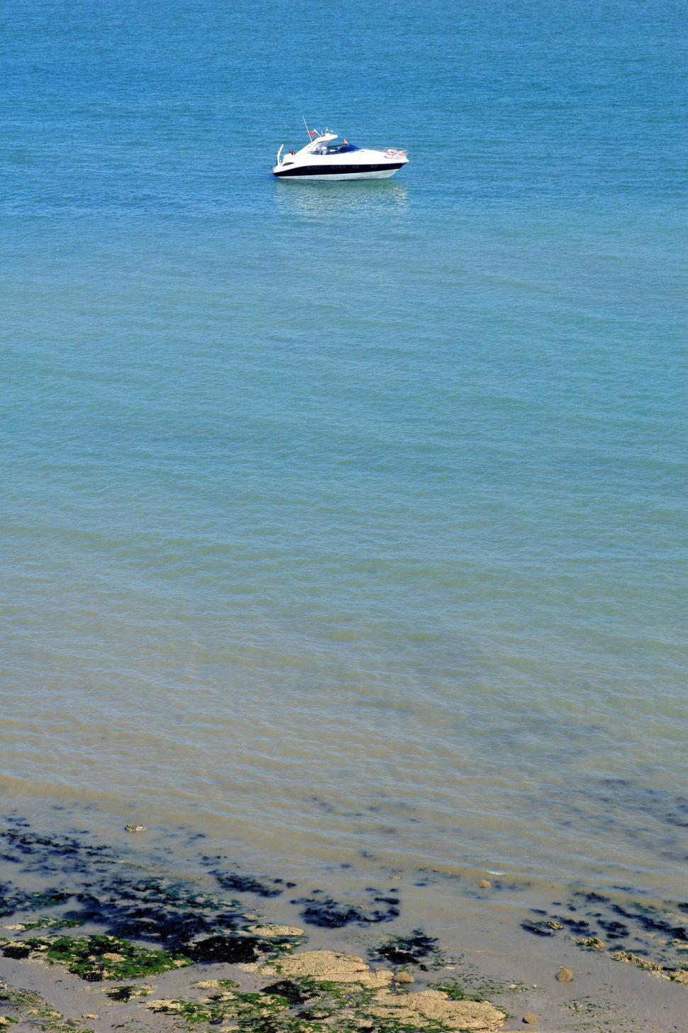 Free Image of Boat Sailing in Water on Sunny Day 