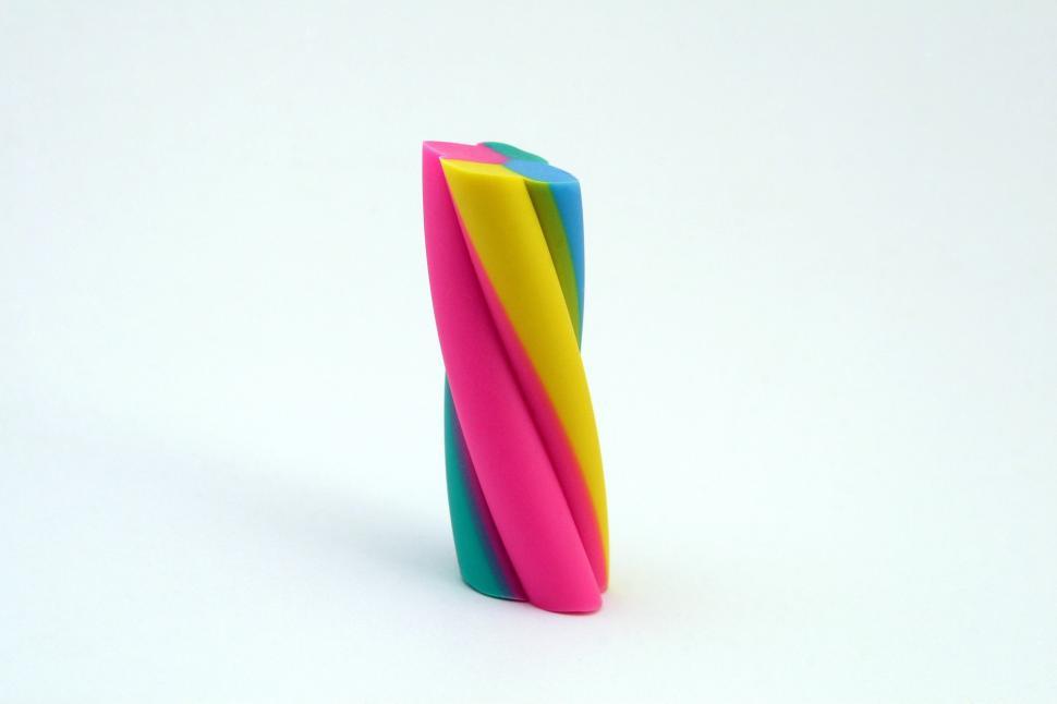 Free Image of Multicolored Toothbrush Holder on White Background 