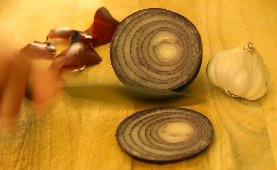 Free Image of Two Onions on Wooden Table 