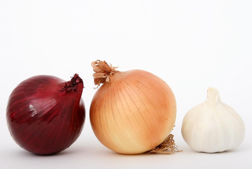 Free Image of Three Onions on White Background 