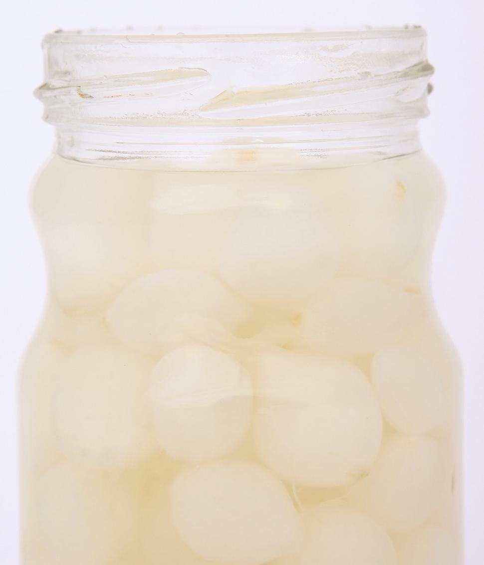 Free Image of A Jar Filled With Lots of White Balls 