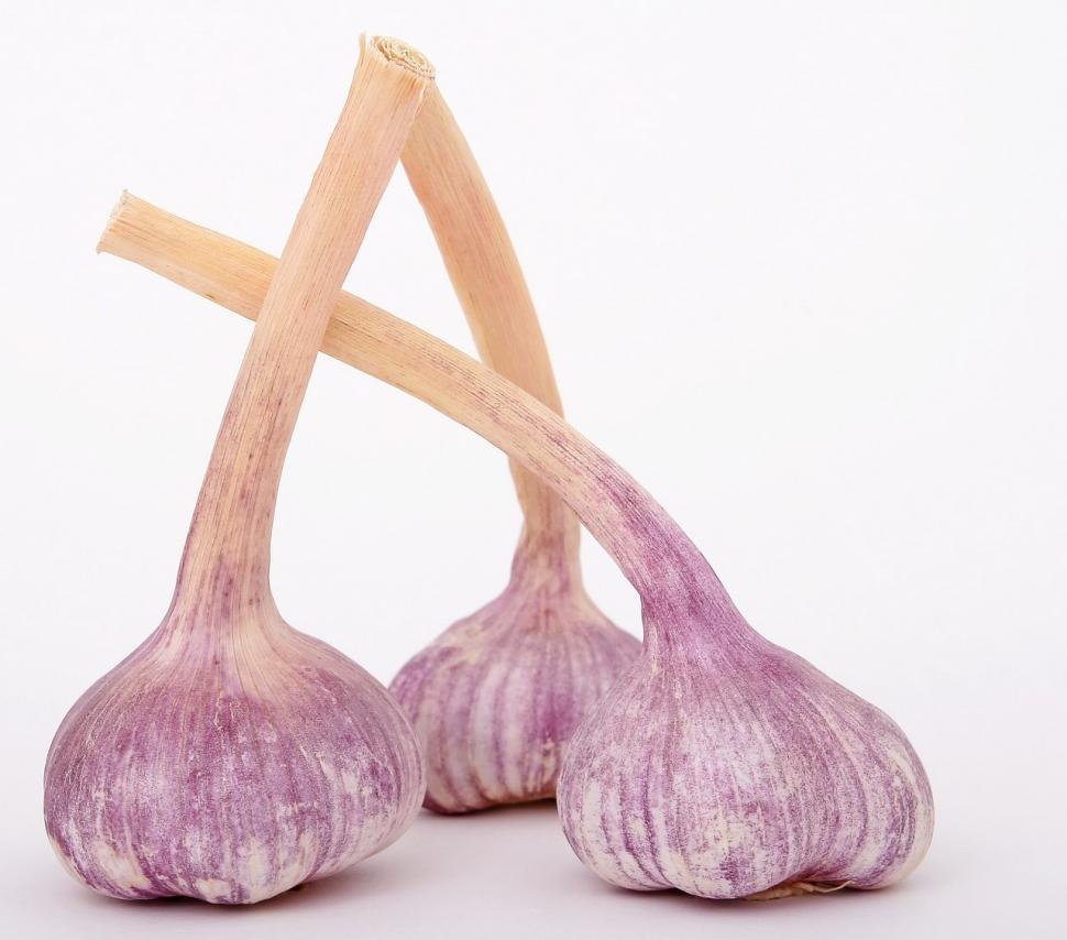 Free Image of Two Garlic Bulbs Placed Next to Each Other 