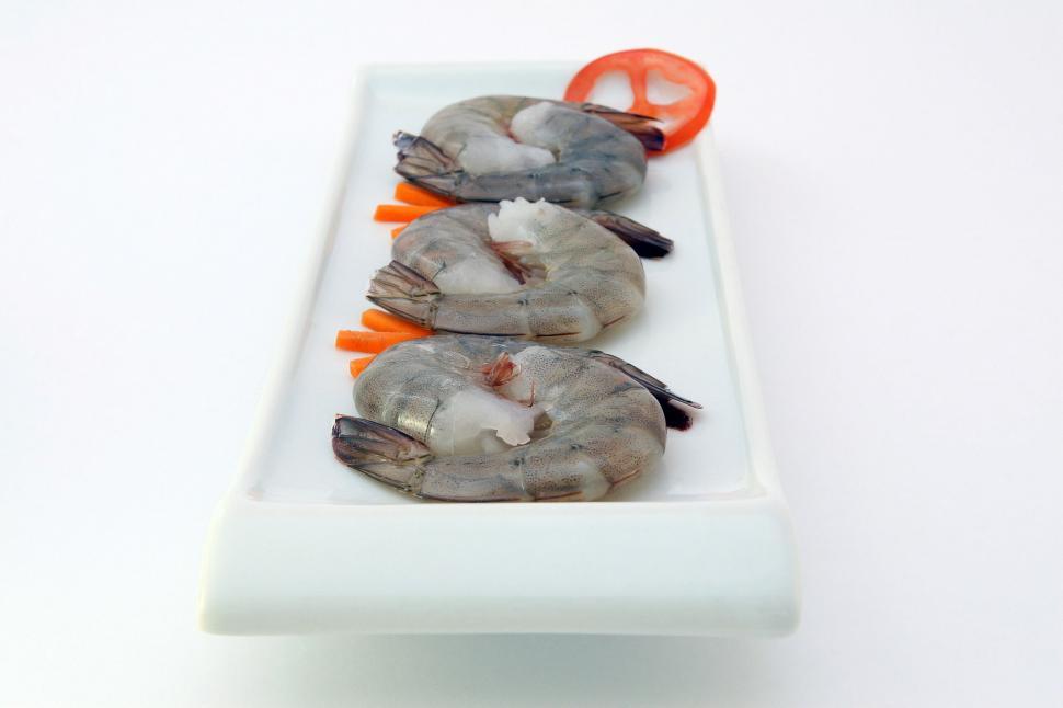 Free Image of Plate With Three Shrimp on Ice 