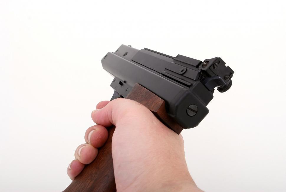 Free Image of Person Holding Gun 